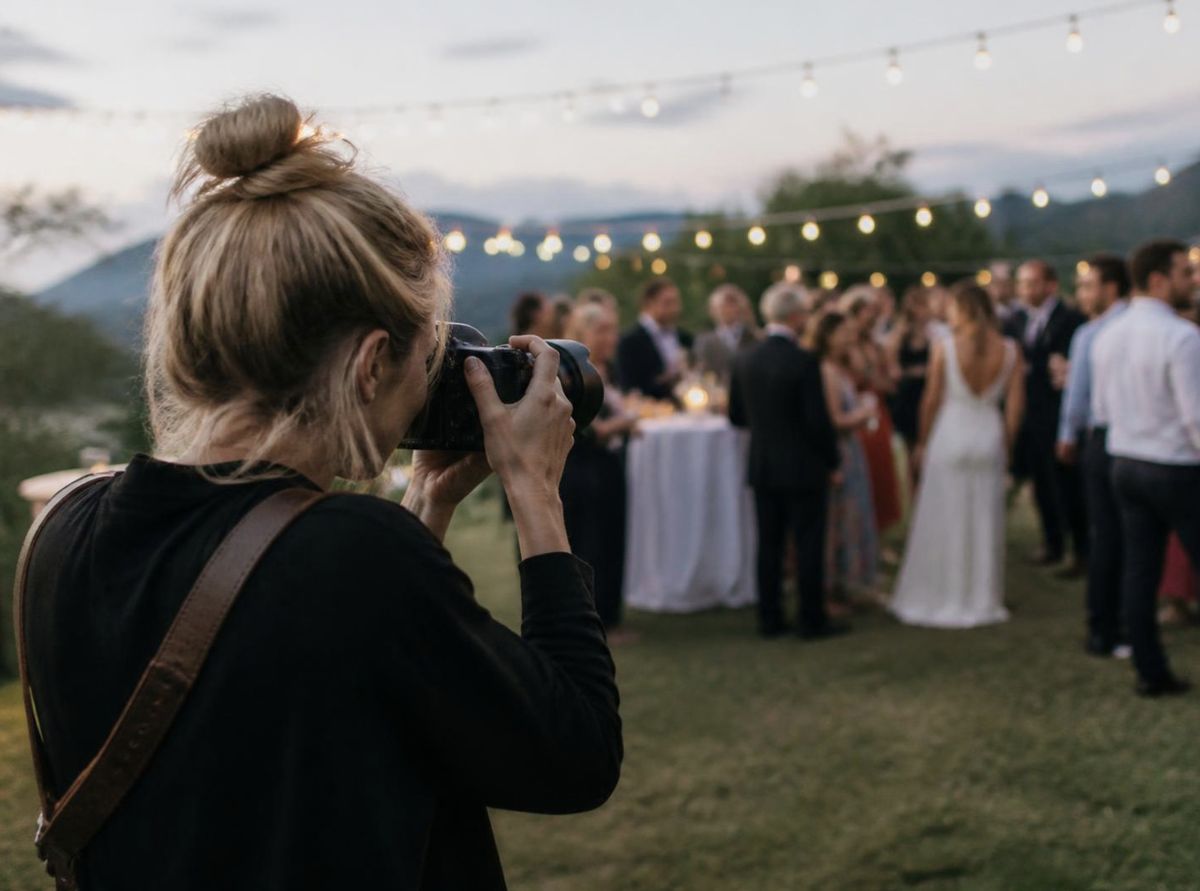 Wedding photographer at an outdoor reception